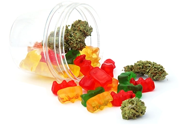 marijuana gummies and flower in a jar
