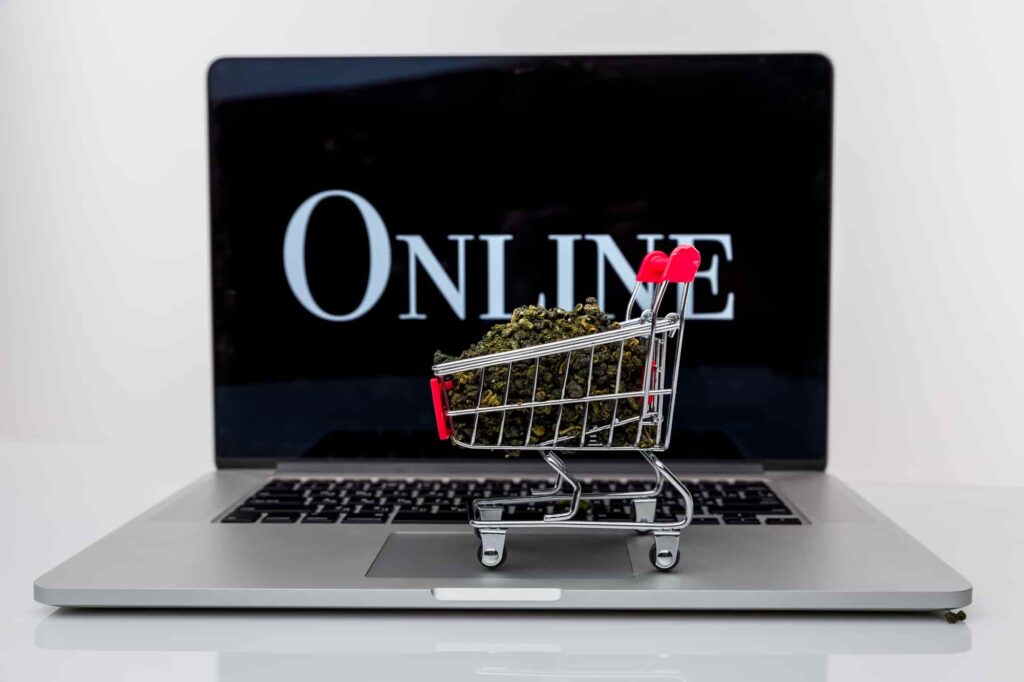 Cannabis Delivery: a shopping cart on a laptop with cannabis on it