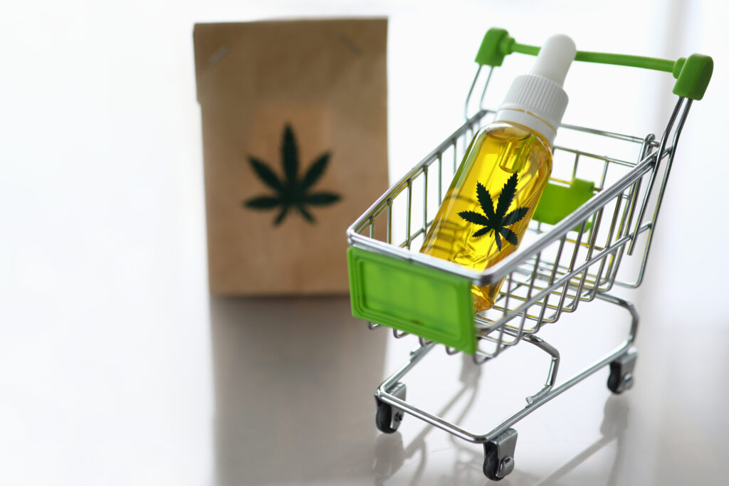 a bottle of cannabis oil in a grocery cart featuring cannabis delivery