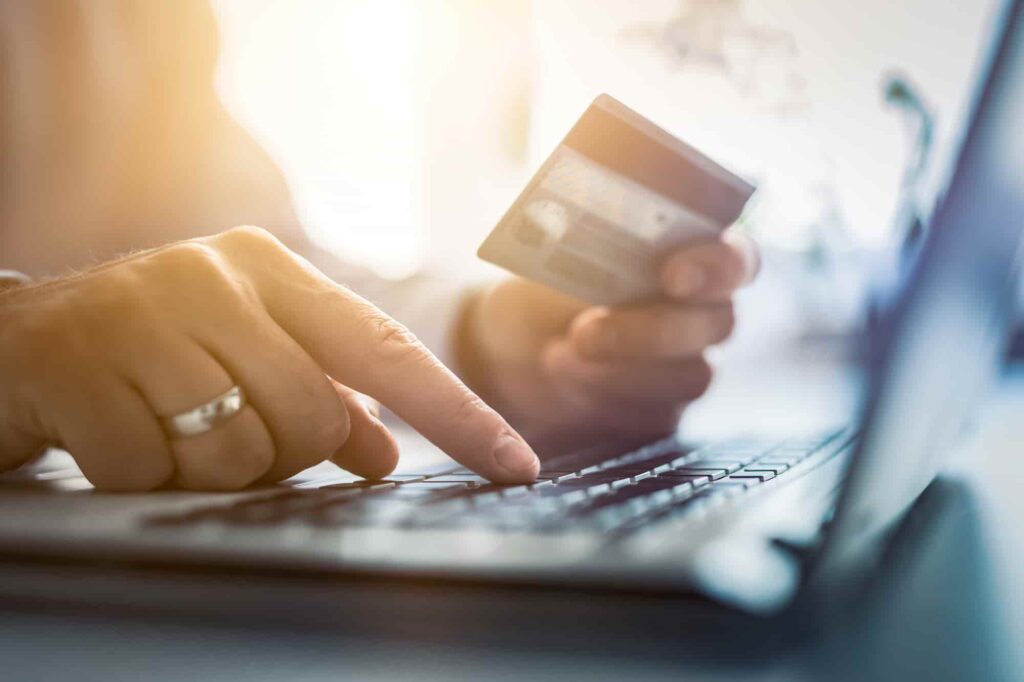 a person holding a credit card paying for cannabis delivery